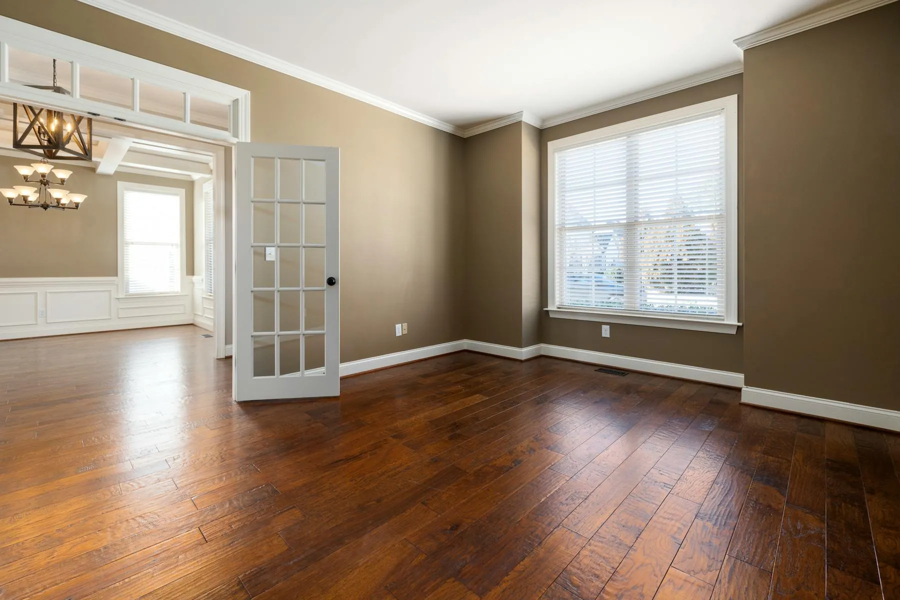 Freshly painted modern living room with crisp trim and soft natural light.